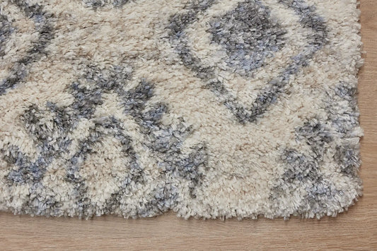 Konya Cream is a Moroccan/Boho inspiration rug. Machine made of Polyester, this shaggy style rugs brings added soften textures. Colours white and blue. Sizes 160 X 230, 200 X 290, 240 X 340 and 300 X 400. Corner.