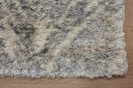 Konya Silver is a Moroccan/Boho inspiration rug. Machine made of Polyester, this shaggy style rugs brings added soften textures. Colours Grey, White, Beige and Light Grey. Sizes 160 X 230, 200 X 290, 240 X 340 and 300 X 400. Corner.