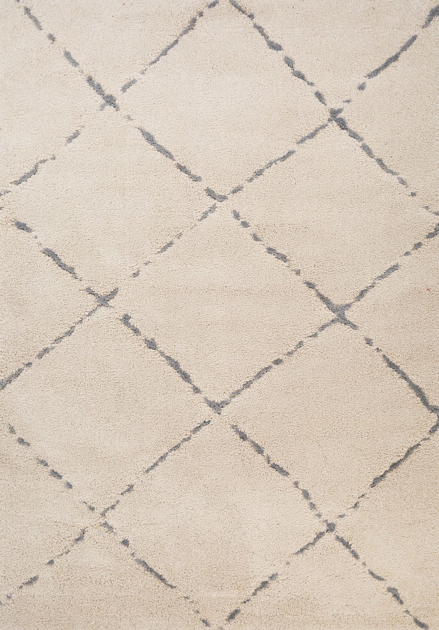 Luana Diamond Ivory Grey is a machine made polypropylene rug. It features a shaggy pile with a moroccan boho inspired design. Colours Ivory with grey diamond pattern. Sizes 160 X 230, 200 X 290, 240 X 320 and 300 X 390. Top.