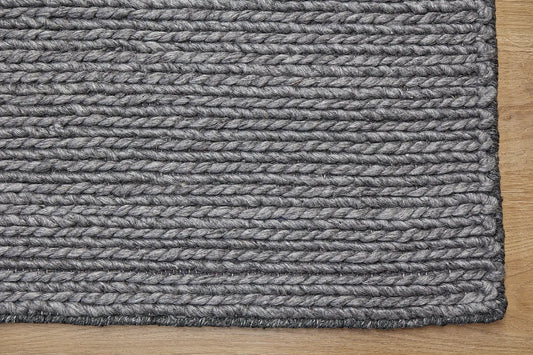 Luxury Smoke is a hand-braided rug crafted using wool and bamboo silk for luxurious feel. Its contemporary Scandinavian design stands out with a modern look and a pile height of 16-18mm. Colour Dark Grey. Sizes 160 X 230, 200 X 290, 240 X 340 and 300 X 400. Corner.
