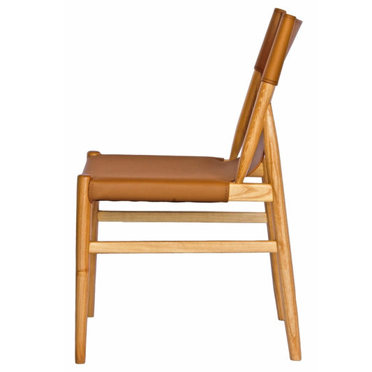 The Modoc - Tan Dining Chair blends style & durability with a solid ash frame & grey saddle leather, perfect for modern, minimalist & coastal spaces. Measures 500 Wide x 570 Depth x 450 Seat Height. Back Height 830. Colour Natural Frame with Tan seat and back. Side.