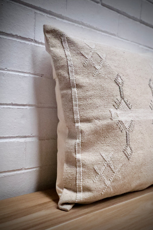 The Moroccan Cloud Cushion is a hand woven cotton weave with hidden zip on the back. Inspired by Moroccan motif's, its sure to bring a Moroccan feel to any area. Colours, light grey and white. Measures 50 X 50. Angle.