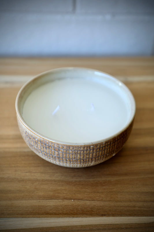 The Ondat Ceramic Candle Pot features a textured outer shell. Its Seasalt scent provides a soothing sense to any room. Colours, beige, cream and browns. Measures 13.5 Diameter X 5.5 Height. Top Styled.