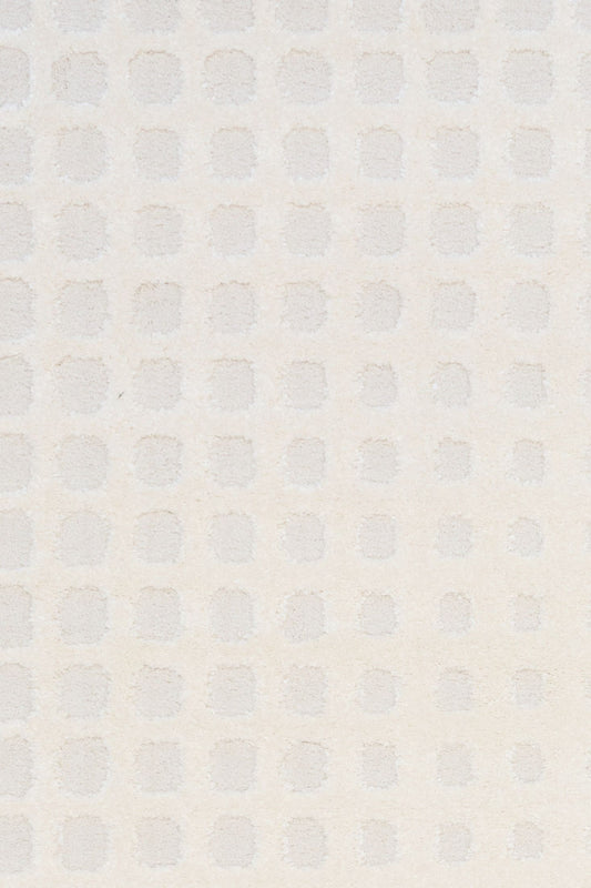 Osmond Squares Ivory rug with soft square patterns in a neutral palette and a high-low textured finish. Colours Ivory and Light Grey. Sizes 160 X 230, 200 X 290 and 240 X 340. Top Close.
