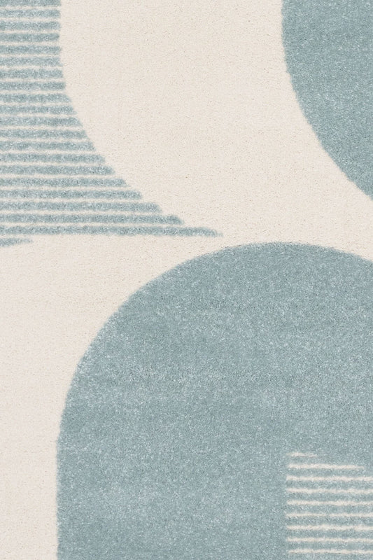 Osmond Waves Light Blue rug with soft geometric patterns in a neutral palette and a high-low textured finish. Colours Light Blue and Ivory. Sizes 160 X 230, 200 X 290 and 240 X 340. Top Close.
