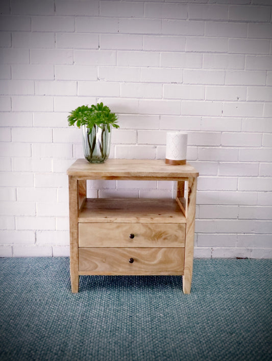 The Ossa - 2 Drawer Bedside. This sleek and contemporary bedside is crafted from solid fruitwood and features 2 drawers, on wood runners, and an open shelf. Measures 600W x 350D x 600H. Styled.