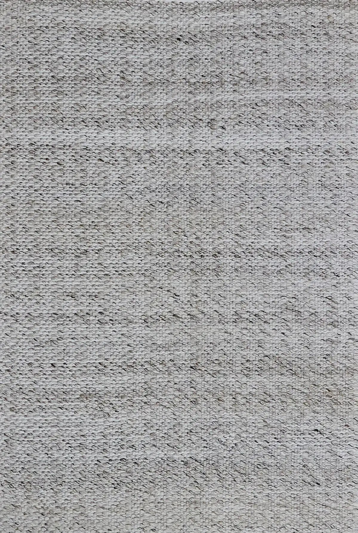 Oxford Taupe is a hand-braided rug with a contemporary design. Crafted with wool and polyester for a textured feel, the rug has a pile height of 7-9mm. Colour Cream with brownish accents. Sizes 160 X 230, 200 X 290, 240 X 340. Full.