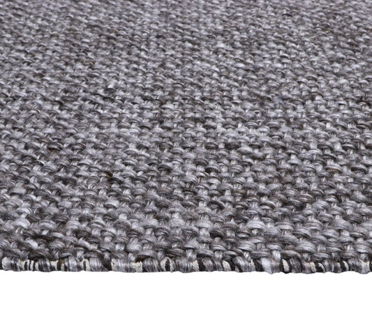 Pacific Brown is a handwoven wool and polyester rug with a low-textured cross weave. It boasts a soft pile height of 7-9mm. Colour brown and grey. Sizes 160 X 230, 200 X 290, 240 X 340 and 300 X 400. Side.