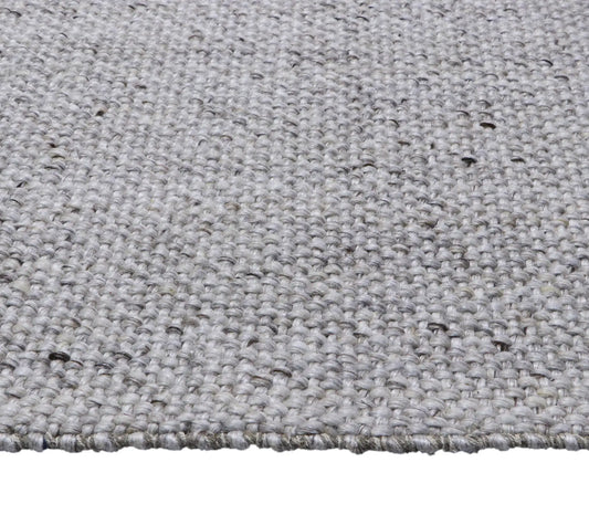 Pacific Camel is a handwoven wool and polyester rug with a low-textured cross weave. It boasts a soft pile height of 7-9mm. Colour White with brownie/black accents. Sizes 160 X 230, 200 X 290, 240 X 340 and 300 X 400. Side.