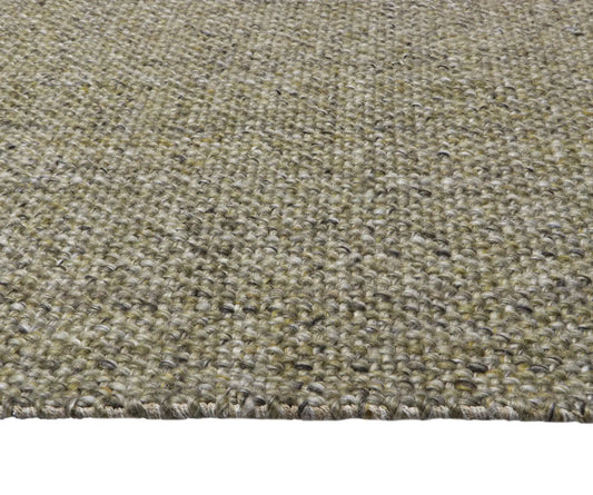 Pacific Cedar is a handwoven wool and polyester rug with a low-textured cross weave. It boasts a soft pile height of 7-9mm. Colour Cedar Green with beige/black accents. Sizes 160 X 230, 200 X 290, 240 X 340 and 300 X 400. Side.