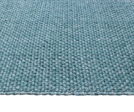 Pacific Green is a handwoven wool and polyester rug with a low-textured cross weave. It boasts a soft pile height of 7-9mm. Colour Aqua Green. Sizes 160 X 230, 200 X 290, 240 X 340 and 300 X 400. Side.