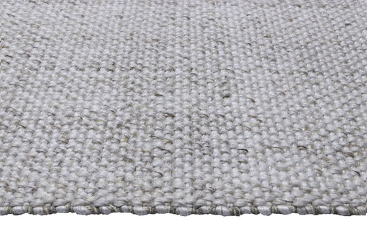 Pacific Grey is a handwoven wool and polyester rug with a low-textured cross weave. It boasts a soft pile height of 7-9mm. Colour White with grey and black accents. Sizes 160 X 230, 200 X 290, 240 X 340 and 300 X 400. Side.