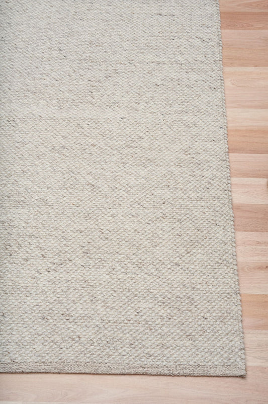 Park Lane Stone is a contemporary hand woven flatweave rug. Made from 80% New Zealand Wool and 20% polyester for a soft and slightly textured feel. Colour Stone Grey. Sizes 155 X 225, 200 X 290, 240 X 320 and 300 X 400. Corner.