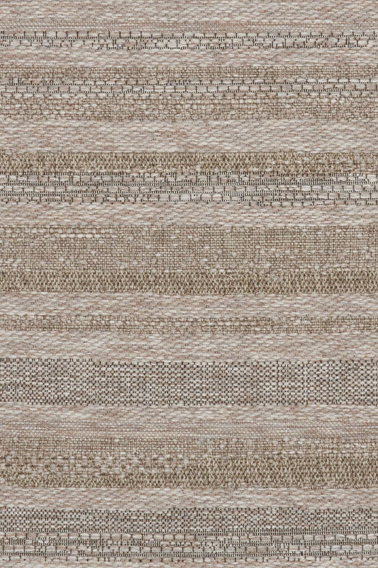 The Patio Linear Straw indoor/outdoor rug featuring neutral tones and a subtle textured pattern, power-loomed from UV-stabilised polypropylene for lasting durability. Colour Browns, Beiges and hints of black. 3 sizes. Close.