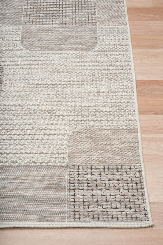 The Patio Linen 50005 indoor/outdoor rug featuring neutral tones and a modern designed pattern, power-loomed from UV-stabilised polypropylene for lasting durability. Colours, Linen, Beiges and hints of light grey. 3 sizes. Corner.