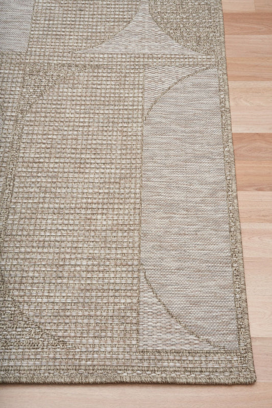 The Patio Straw 65001 indoor/outdoor rug featuring neutral tones and a modern designed pattern, power-loomed from UV-stabilised polypropylene for lasting durability. Colours, Linen, Beiges and hints of light grey. 3 sizes. Corner.
