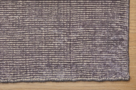 Pearl Garnet is a luxurious hand-loomed knotted rug made with wool and silky viscose. It boasts a ribbed texture and pile height of 12-14mm. Colour Blueish Grey with Beige accents. Sizes 160 X 230, 200 X 290 and 240 X 340. Corner.