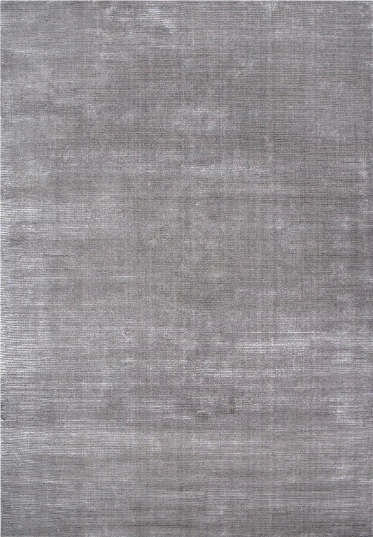 Pearl Grace is a luxurious hand-loomed knotted rug made with wool and silky viscose. It boasts a ribbed texture and pile height of 12-14mm. Colour Silver Grey. Sizes 160 X 230, 200 X 290 and 240 X 340. Full.