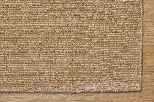 Pearl Olive is a luxurious hand-loomed knotted rug made with wool and silky viscose. It boasts a ribbed texture and pile height of 12-14mm. Colour light olive green. Sizes 160 X 230, 200 X 290 and 240 X 340. Corner.