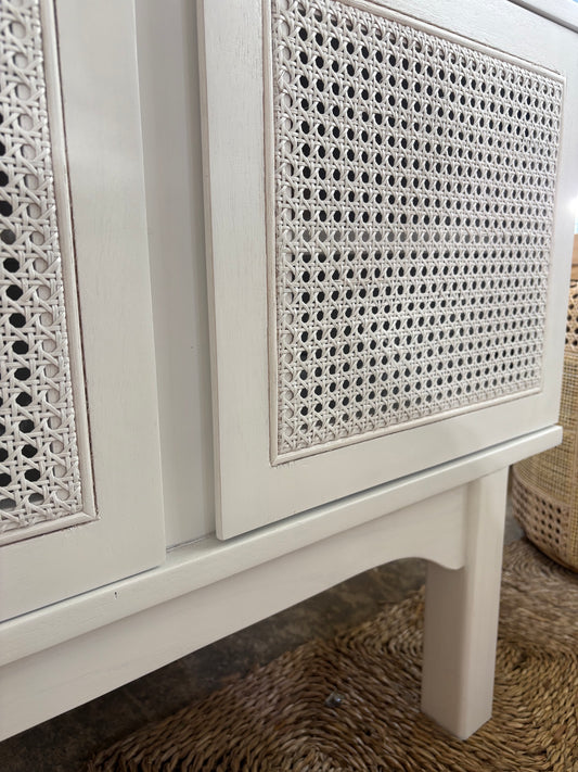 The Pendleton 4 door white buffet features four rattan mesh doors and is made from sustainable white cedar. Colour white. Measures 1800 length X 400 depth X 700 height. Close