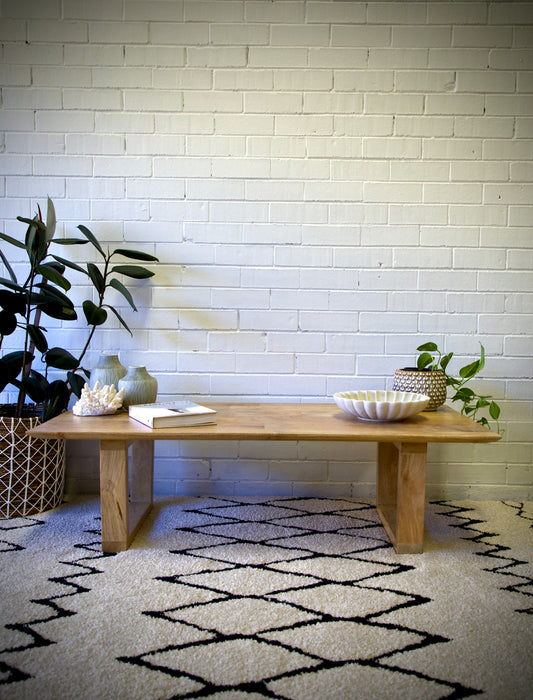 The Presley Coffee Table features a rectangular top and a u-leg design.  Crafted from sustainable fruitwood. Colour natural. Measures 1400 length X 700 wide X 400 height. Front Styled.