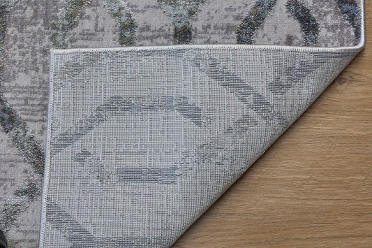 Raj Silver is a machine made rug. Its design boasts a geometric modern/contemporary feel. Crafted from Viscose and Polyester, with a low-profile 7-9mm pile height. Colours Light Grey with grey and beige/white accents. Sizes 160 X 230, 200 X 290, 240 X 340 and 300 X 400. Fold.
