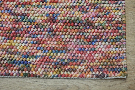 Rocks Multi is a luxurious hand-woven wool carpet. Boasting a plush loop pile with 8-18mm pile height. Colour Multi coloured. Sizes 160 X 230, 200 X 290, 240 X 340 and 290 X 390. Corner.