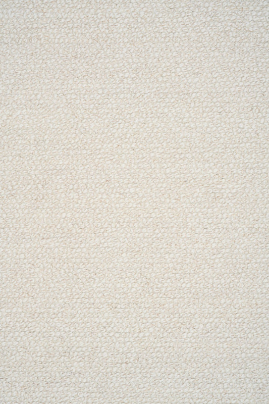 Sahara Ivory Rug – hand woven 100% wool rug in soft neutral tones with a textured finish, available in three sizes, styled for modern and coastal homes. Close.