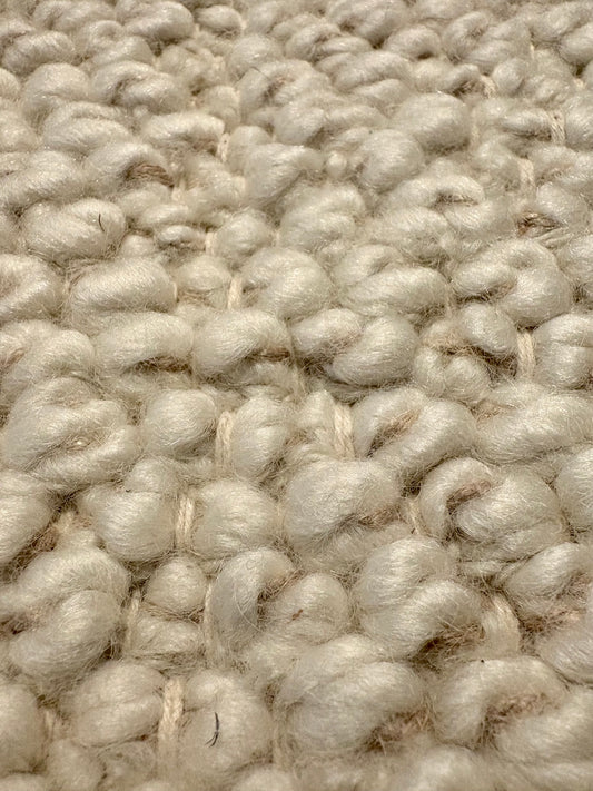 Sahara Ivory Rug – hand woven 100% wool rug in soft neutral tones with a textured finish, available in three sizes, styled for modern and coastal homes. Super Close.