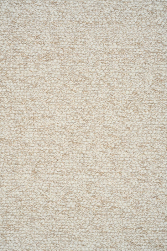 Sahara Wheat Rug – hand woven 100% wool rug in soft neutral tones with a textured finish, available in three sizes, styled for modern and coastal homes. Close.