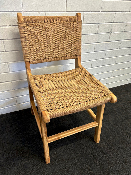 The Seneca Dining Chair features a sustainable teak frame and hand-crafted rope seat and back. Colours, natural frame with white rope. Measures 450 wide X 550 depth. Angle.