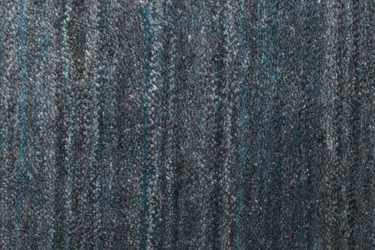 Shadow Sea Green is a hand-tufted rug from a blend of wool and silky viscose with a smooth pile and a 12-14mm pile height. Colour Dark green with grey and black accents. Sizes 160 X 230, 200 X 290 and 240 X 340. Close.