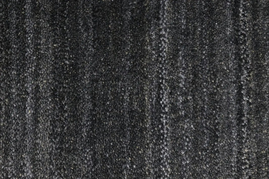 Shadow Smoke is a hand-tufted rug from a blend of wool and silky viscose with a smooth pile and a 12-14mm pile height. Colour black with light grey and silver accents. Sizes 160 X 230, 200 X 290 and 240 X 340. Close.