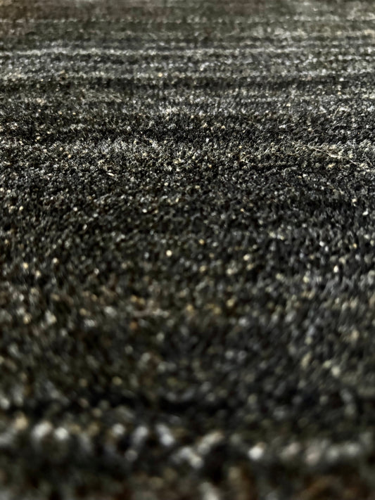 Shadow Sea Green is a hand-tufted rug from a blend of wool and silky viscose with a smooth pile and a 12-14mm pile height. Colour Dark green with grey and black accents. Sizes 160 X 230, 200 X 290 and 240 X 340. Close Angle.