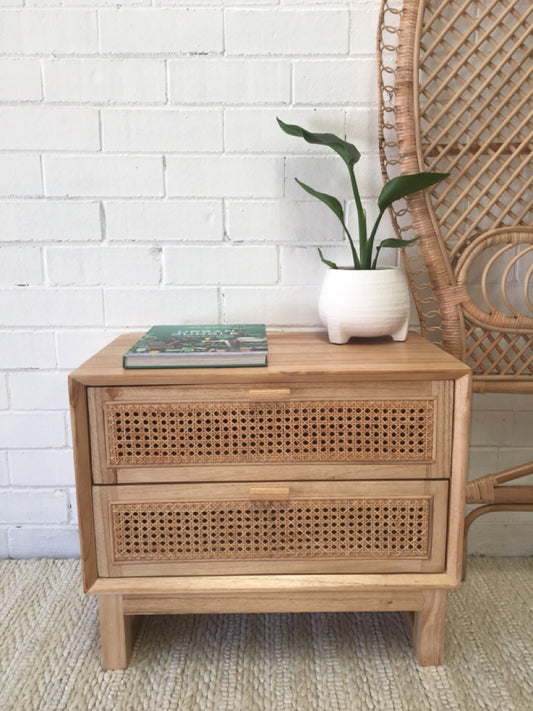 The Shasta 2 Drawer Natural Bedside offers a modern coastal aesthetic. Crafted from white cedar and rattan and featuring two drawers, on wood runners. Colour natural. Measures 600 wide X 350 depth X 500 height. Front Styled.