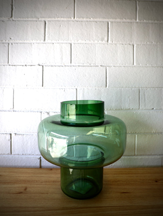 The Svend Glass Vase, a modern/contemporary deigned vase. Featuring a cylindrical bottom and top with a bulbed middle. Colour, light green. Measures 24 Diameter X 24.5 Height. Plain.