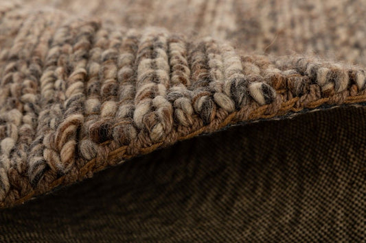 Svend Mocha is a contemporary hand woven braided pile wool rug. Colour Mocha brown. Sizes 155 X 225, 200 X 290, 240 X 320 and 300 X 400. Side.