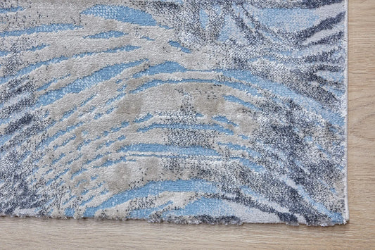 Swiss Blue is a machine-made polyester rug with an abstract modern/contemporary design. It boasts a 7-9mm pile height. Colours white and silver with blue accents. Sizes 160 X 230, 200 X 290, 240 X 340 and 300 X 400. Corner.