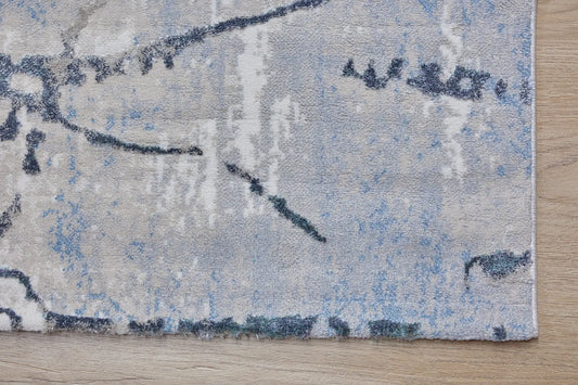 Swiss Silver is a machine-made polyester rug with an abstract modern/contemporary design. It boasts a 7-9mm pile height. Colours silver with grey and blue accents. Sizes 160 X 230, 200 X 290, 240 X 340 and 300 X 400. Corner.
