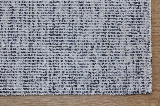 Toro Dark Grey is a hand-loomed, hand-knotted rug with a contemporary multi-fleck design. Wool and silky viscose are blended to create a soft feel with its 10-12mm pile height. Colour light grey with dark grey accents. Sizes 160 X 230, 200 X 290, 240 X 340 and 300 X 400. Corner.