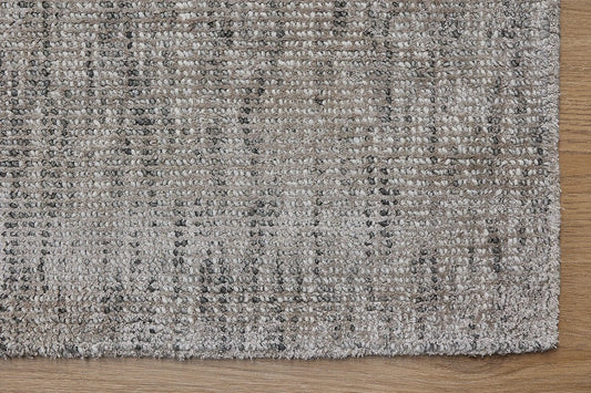 Toro Taupe is a hand-loomed, hand-knotted rug with a contemporary multi-fleck design. Wool and silky viscose are blended to create a soft feel with its 10-12mm pile height. Colour Beige with cream and black accents. Sizes 160 X 230, 200 X 290, 240 X 340 and 300 X 400. Corner.