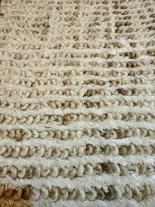 Toro Beige is a hand-loomed, hand-knotted rug with a contemporary multi-fleck design. Wool and silky viscose are blended to create a soft feel with its 10-12mm pile height. Colour light beige with brown accents. Sizes 160 X 230, 200 X 290, 240 X 340 and 300 X 400. Close.