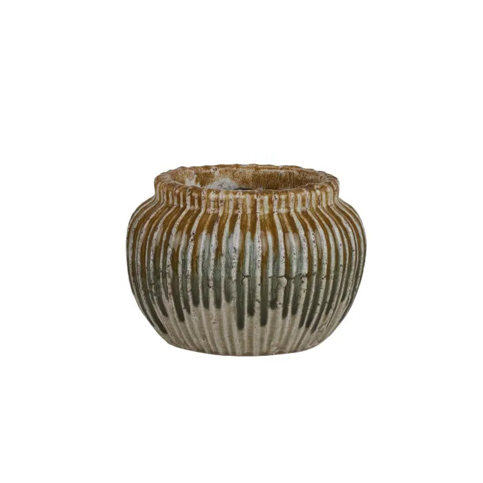 The Varuna Ceramic Pot - Small, features a textured ribbed outer shell. Great for small plants. Colour, Olive and Teal. Size 20 Diameter X 14 Height. Front Plain.