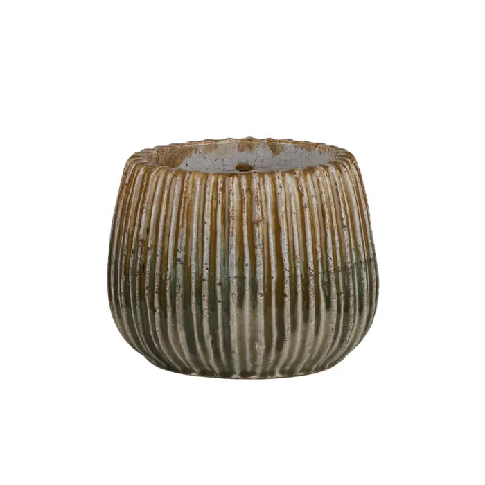 The Varuna Ceramic Pot - Medium, features a textured ribbed outer shell. Great for small plants. Colour, Olive and Teal. Size 23 Diameter X 18 Height. Front Plain.