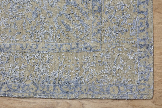 Victoria Silver is hand-loomed rug from silky viscose. Featuring a vintage distressed traditional design and medium texture. Has a pile height of 10-12mm. Colour Silver with light blue accents. Sizes 160 X 230, 200 X 290 and 240 X 340. Corner.