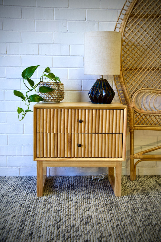 The Whistler 2 Drawer Bedside is crafted from sustainable white cedar and features two drawers, on wood runners, with a stylish textured drawer cover. Colour natural. Measures 600 wide X 350 depth X 600 height. Front Styled.