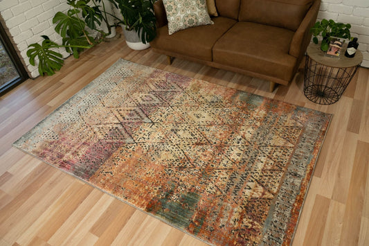 Zarita Noble is a machine made rug from soft and durable polyester. Featuring Tribal diamond patterns. Colours Reds, Golds, Blacks and Light Greys. Sizes 240 X 320 and 300 X 380. Life.