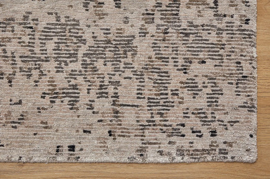 Zurich Grey is a luxurious contemporary/modern designed rug. Hand Knotted from a blend of wool and bamboo Silk. Colours Light Grey, Dark Grey, and Grey. Sizes 200 X 290, 250 X 300 and 270 X 360. Corner.