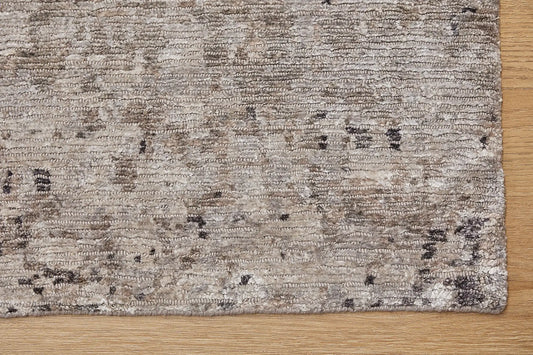 Zurich Smoke is a luxurious contemporary/modern designed rug. Hand Knotted from a blend of wool and bamboo Silk. Colours Dark Grey, Grey, and Light Greys. Sizes 200 X 290, 250 X 300 and 270 X 360. Corner.