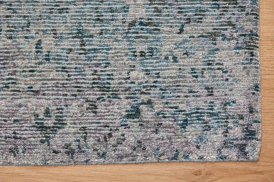 Zurich Teal is a luxurious contemporary/modern designed rug. Hand Knotted from a blend of wool and bamboo Silk. Colours Teal Green, Light Grey, and Grey. Sizes 200 X 290, 250 X 300 and 270 X 360. Corner.